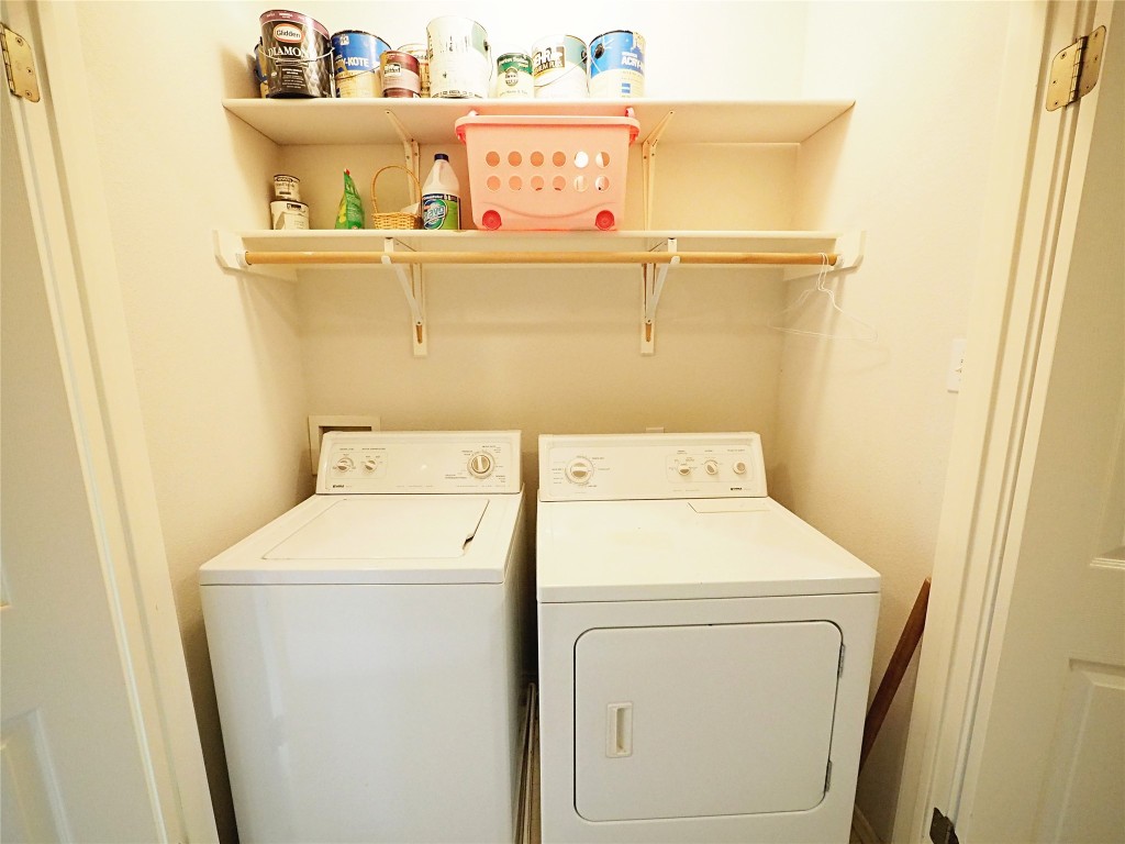 12401 Los Indios Trail, Unit 13 Austin, TX 78729 - Photo 10 of 27 a utility room with dryer and washer