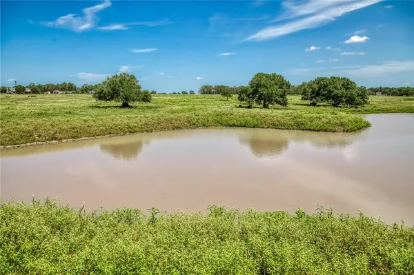 a view of a lake with a big yard