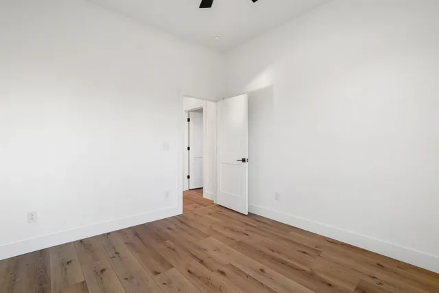 a bathroom with double vanity sink and two mirror