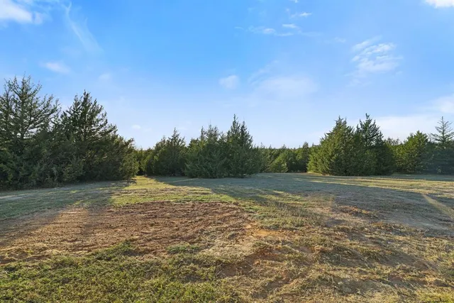 a view of swimming pool with sitting area