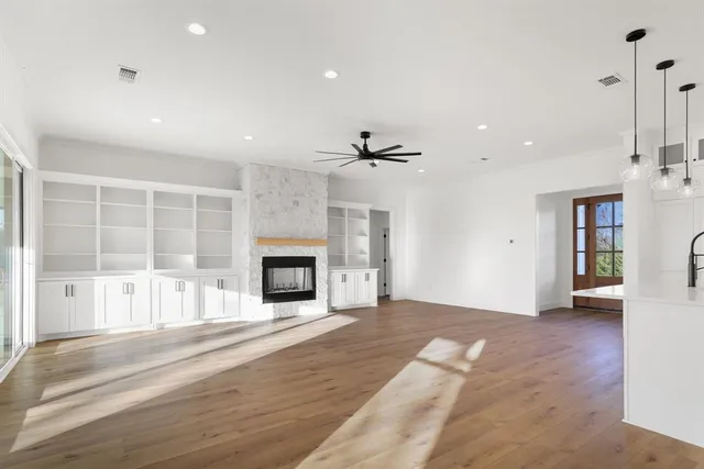 a view of a kitchen with stainless steel appliances