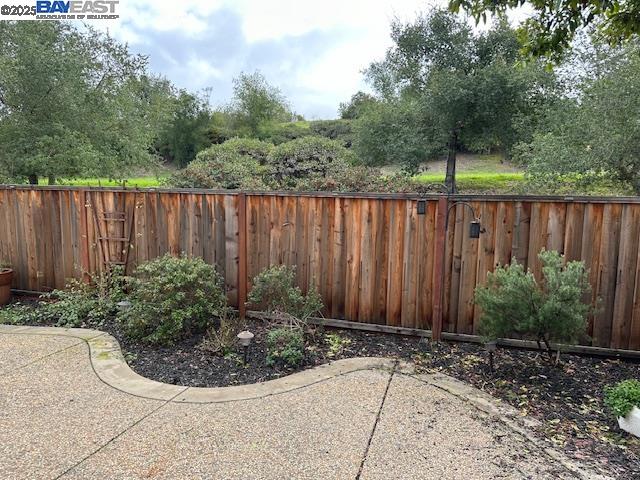 7187 Briza Loop San Ramon, CA 94582 - Photo 20 of 23 a view of a backyard with plants and wooden fence