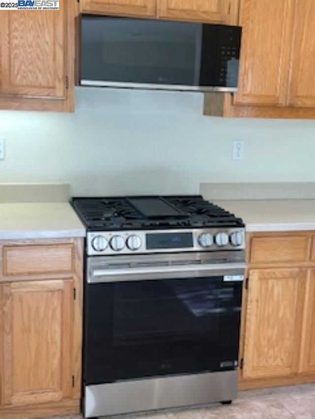 7187 Briza Loop San Ramon, CA 94582 - Photo 22 of 26 a stove top oven sitting inside of a kitchen