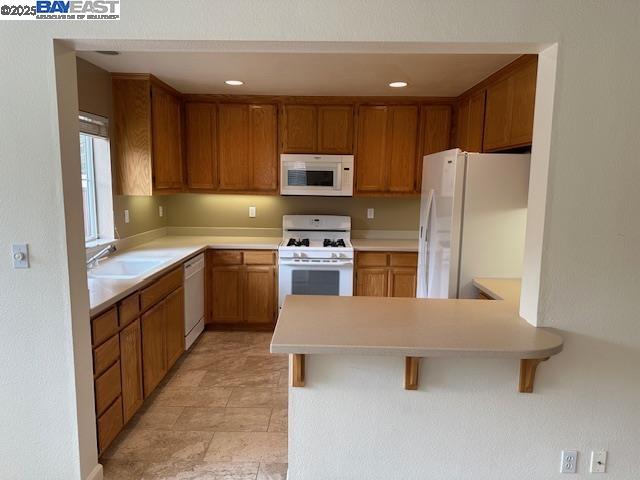 7187 Briza Loop San Ramon, CA 94582 - Photo 6 of 23 a kitchen with a sink refrigerator and microwave