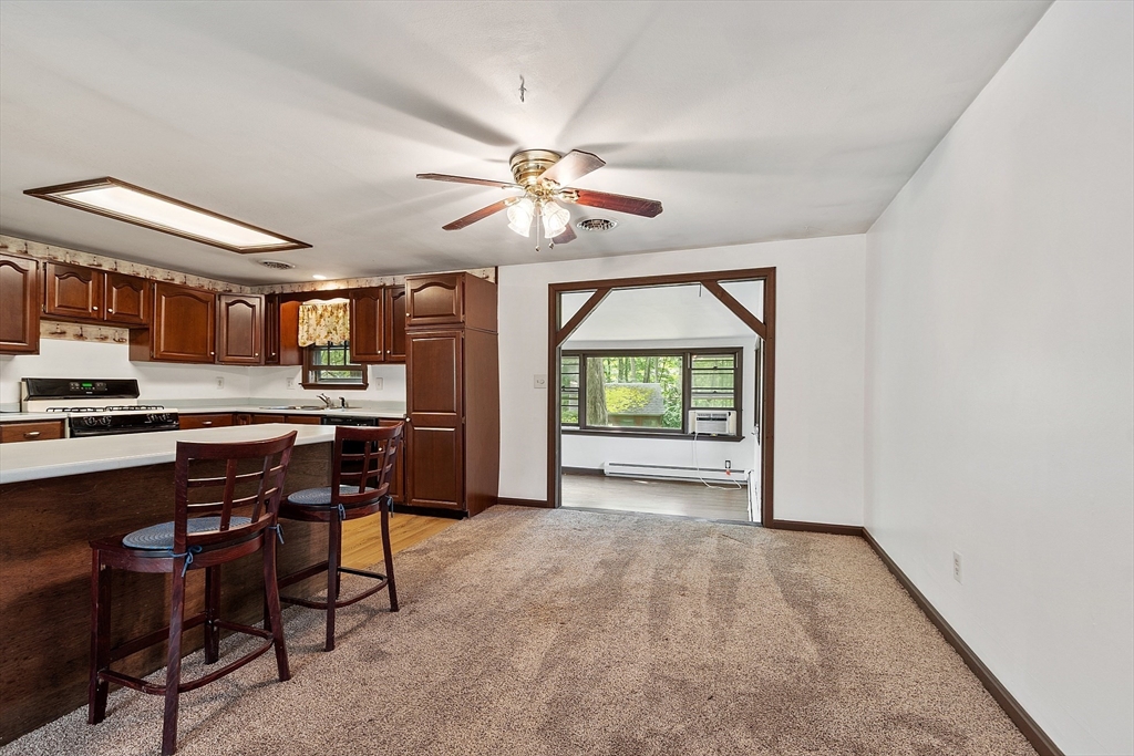 25 Cushing Street Salisbury, MA 01952 - Photo 11 of 40 a view of a livingroom with furniture and a kitchen