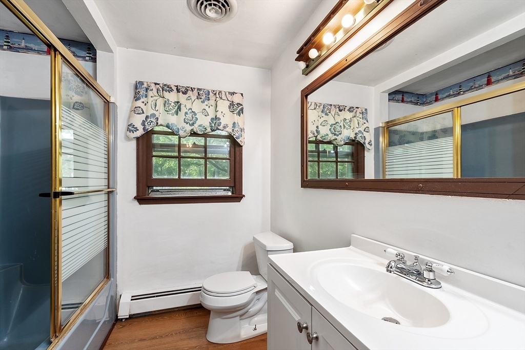 25 Cushing Street Salisbury, MA 01952 - Photo 15 of 40 a bathroom with a sink vanity and a toilet