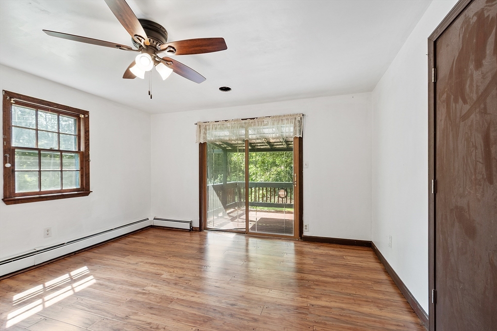25 Cushing Street Salisbury, MA 01952 - Photo 16 of 40 wooden floor in an empty room with a window