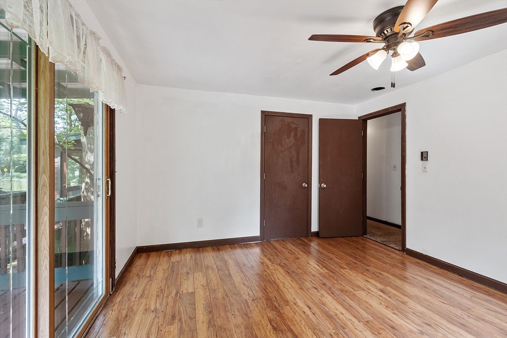 25 Cushing Street Salisbury, MA 01952 - Photo 17 of 40 a view of empty room with wooden floor and fan