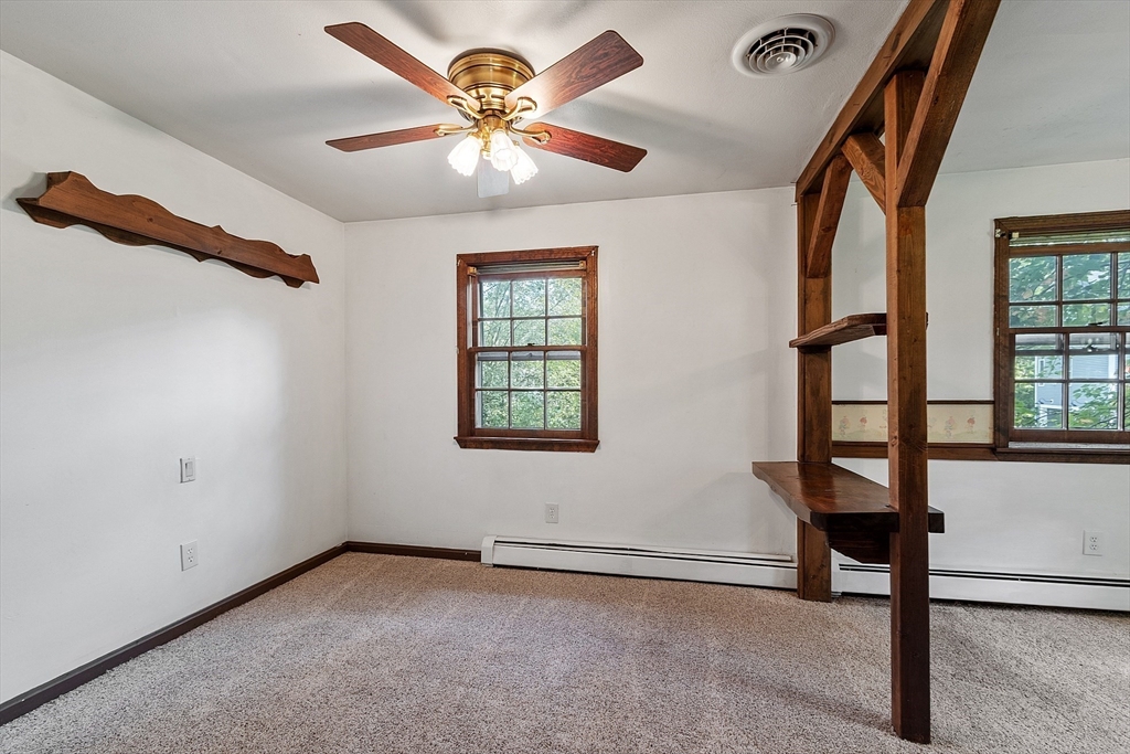 25 Cushing Street Salisbury, MA 01952 - Photo 18 of 40 an empty room with windows and fan