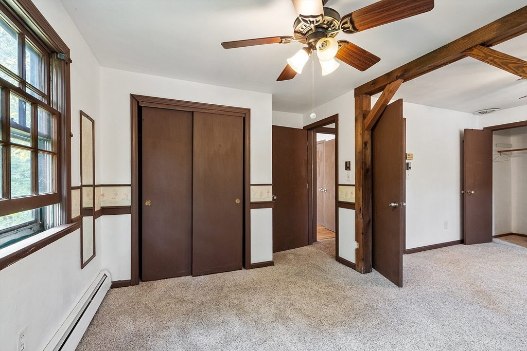 25 Cushing Street Salisbury, MA 01952 - Photo 21 of 40 a view of a big room with chandelier fan and windows