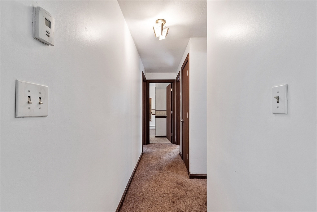 25 Cushing Street Salisbury, MA 01952 - Photo 22 of 40 a view of a hallway with wooden floor