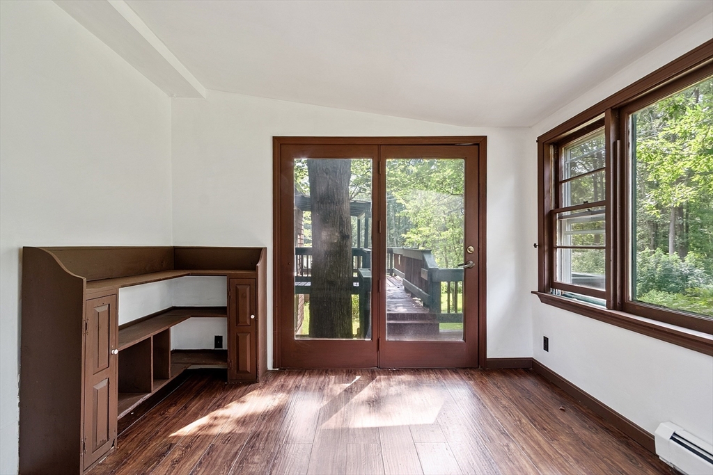 25 Cushing Street Salisbury, MA 01952 - Photo 24 of 40 a view of an empty room with a fireplace and a window