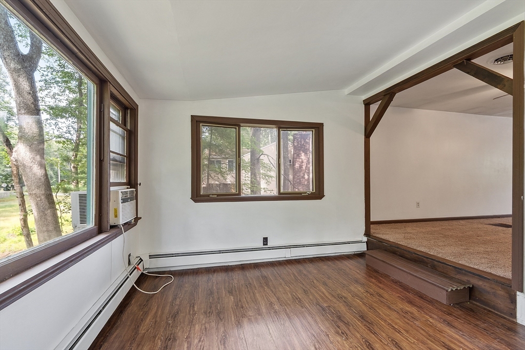 25 Cushing Street Salisbury, MA 01952 - Photo 25 of 40 a view of an empty room with wooden floor and a window