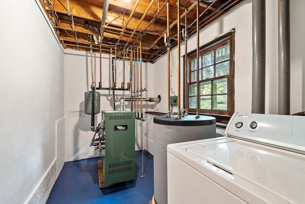 25 Cushing Street Salisbury, MA 01952 - Photo 29 of 40 a utility room with dryer and washer