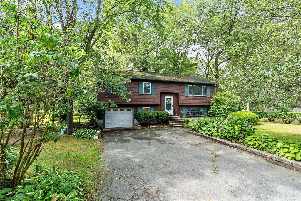 25 Cushing Street Salisbury, MA 01952 - Photo 3 of 40 a view of a house with a tree in front of it