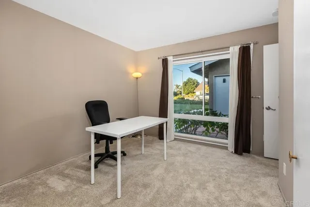 a workspace with furniture and a window