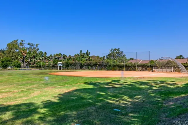 a view of a golf course with a lake