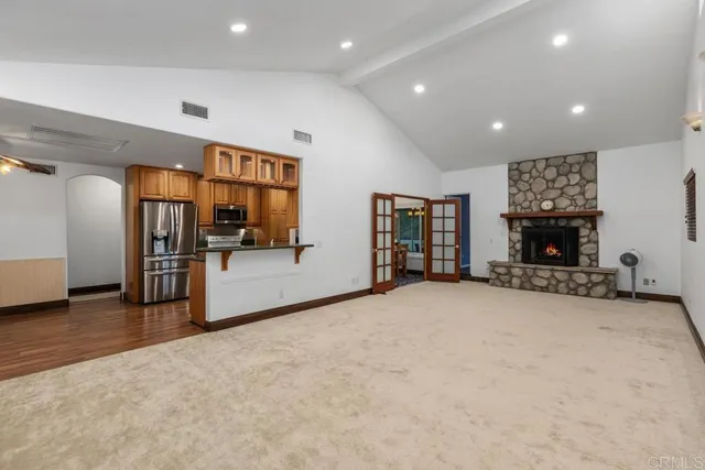 a view of a livingroom with furniture and a fireplace