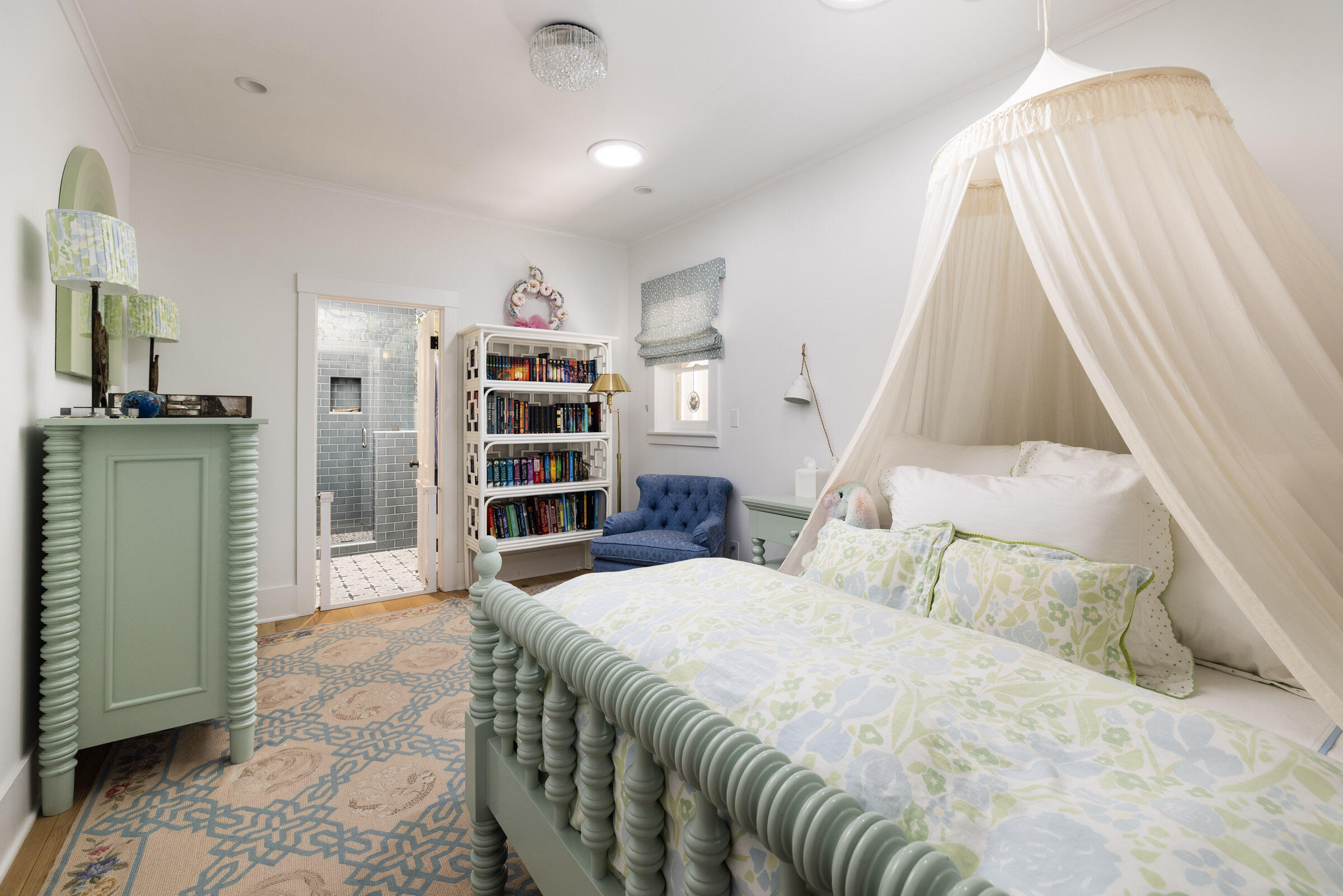 1166 Summit Road Montecito, CA 93108 - Photo 19 of 42 a bedroom with a bed and a book shelf