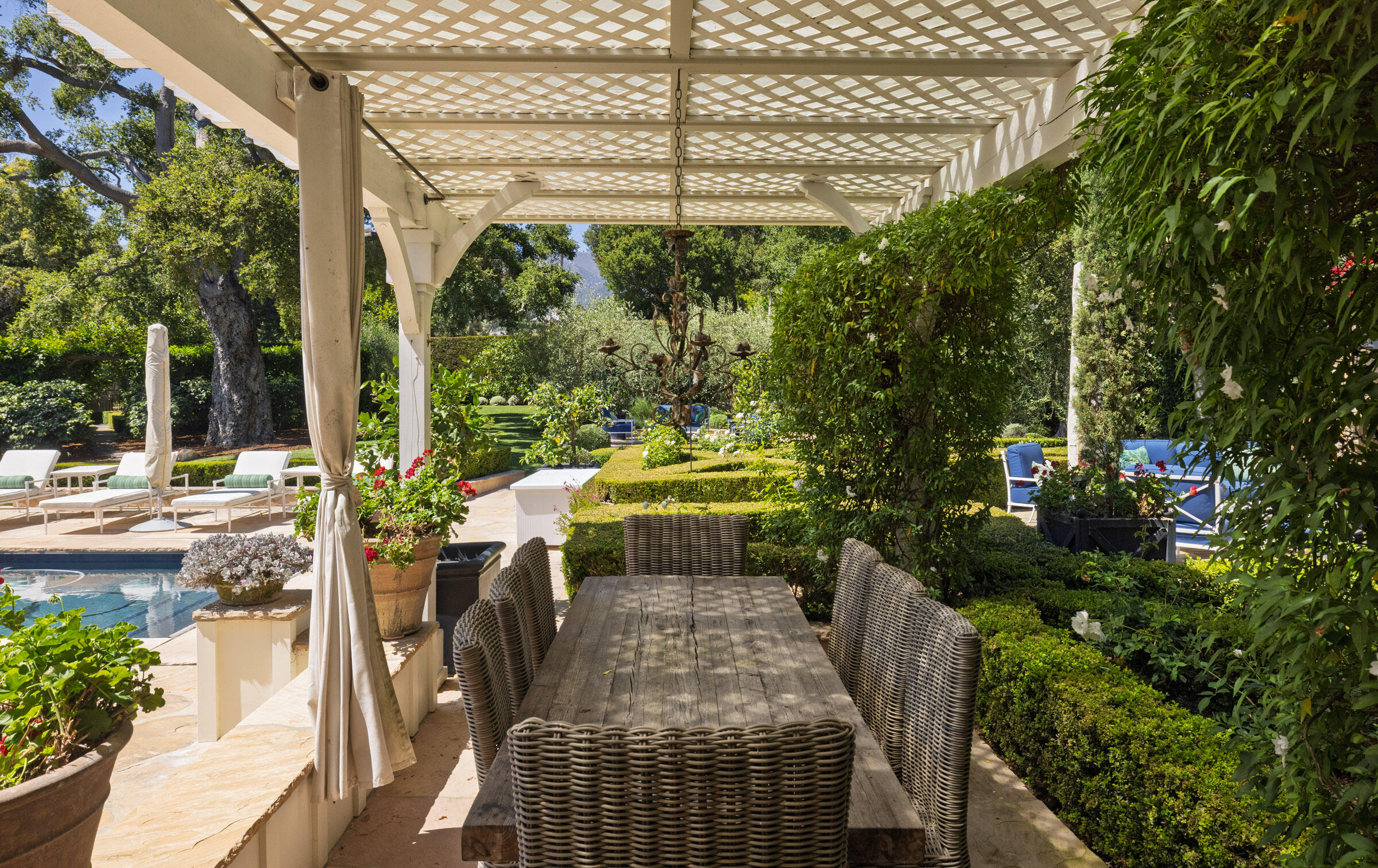1166 Summit Road Montecito, CA 93108 - Photo 26 of 42 a view of a patio with table and chairs and potted plants
