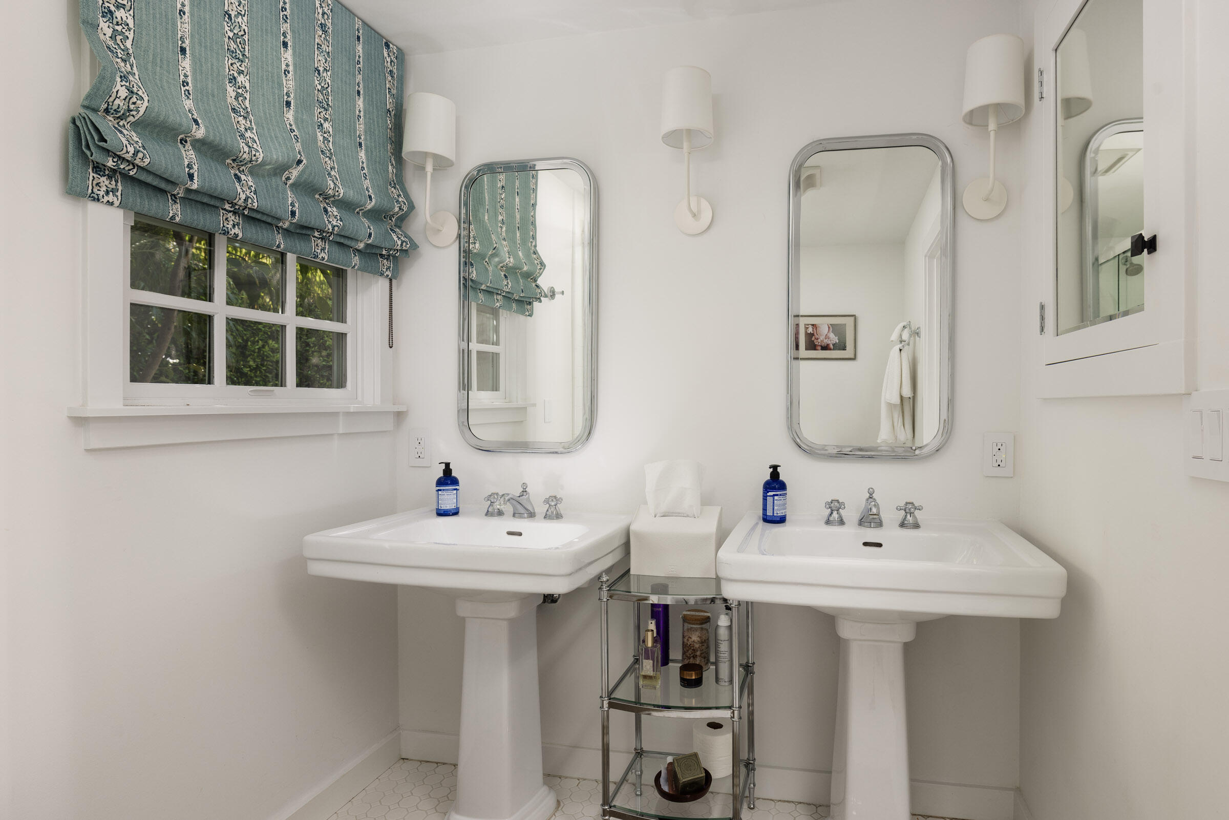 1166 Summit Road Montecito, CA 93108 - Photo 35 of 42 a bathroom with a sink and a mirror