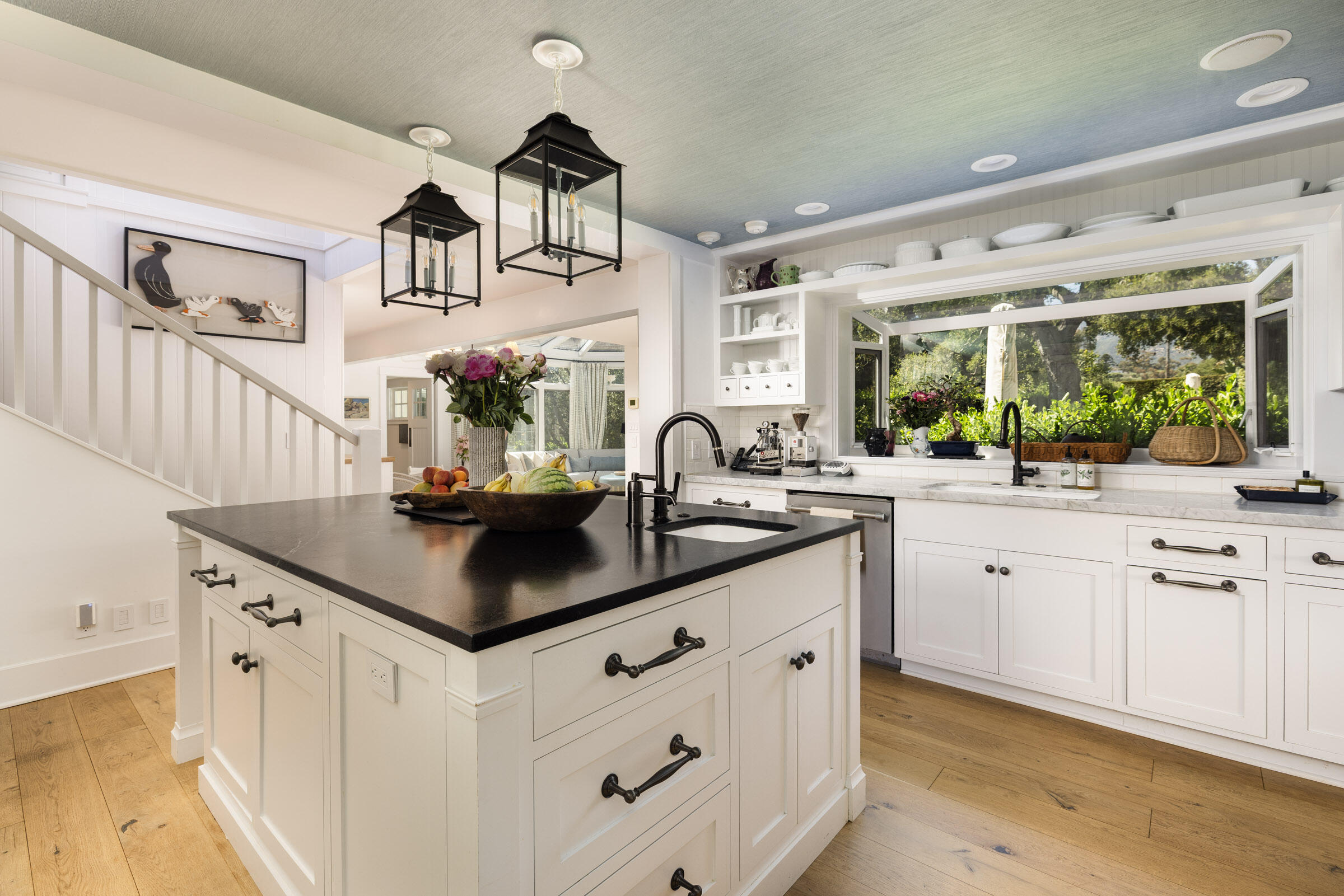 1166 Summit Road Montecito, CA 93108 - Photo 8 of 42 a kitchen with kitchen island a sink and white cabinets