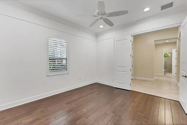 a view of a kitchen with kitchen island stainless steel appliances refrigerator sink and cabinets