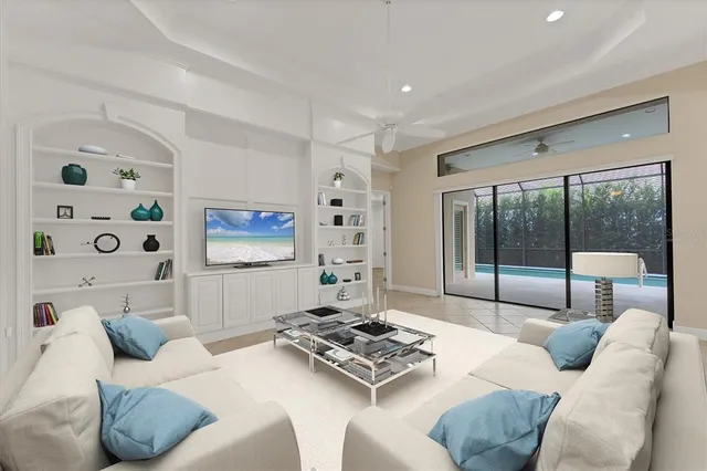 a kitchen with stainless steel appliances granite countertop a sink and a refrigerator