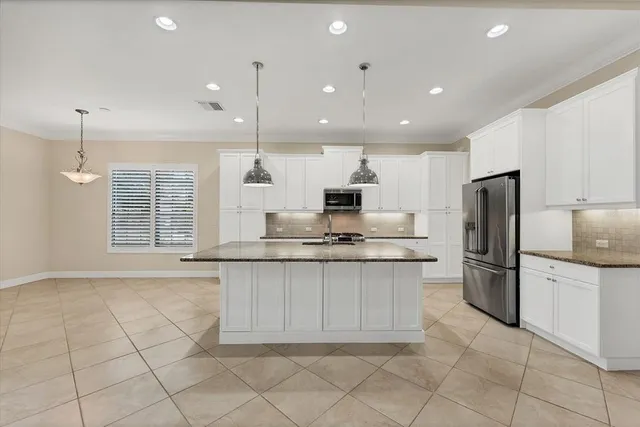 a bathroom with a tub sink toilet and shower