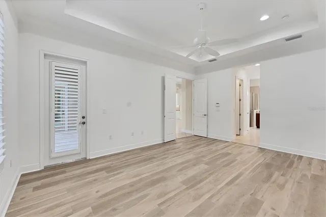 a aerial view of a house with swimming pool and lake view
