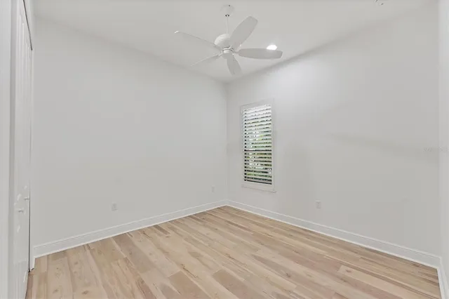a view of a swimming pool with a table and chairs