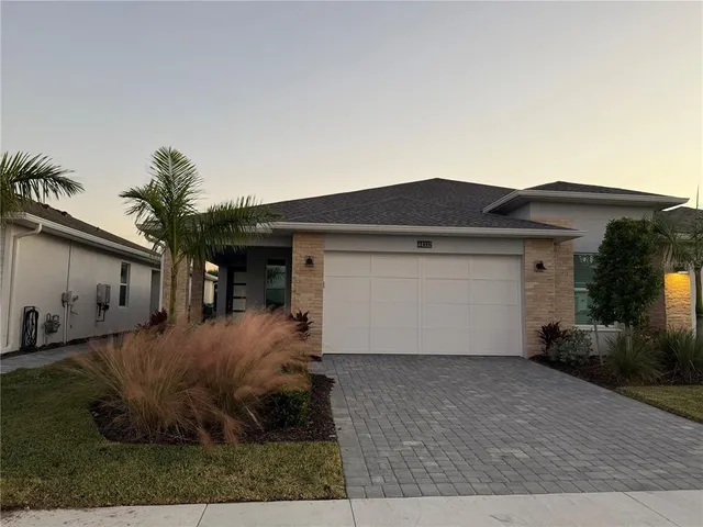 a front view of house with garage