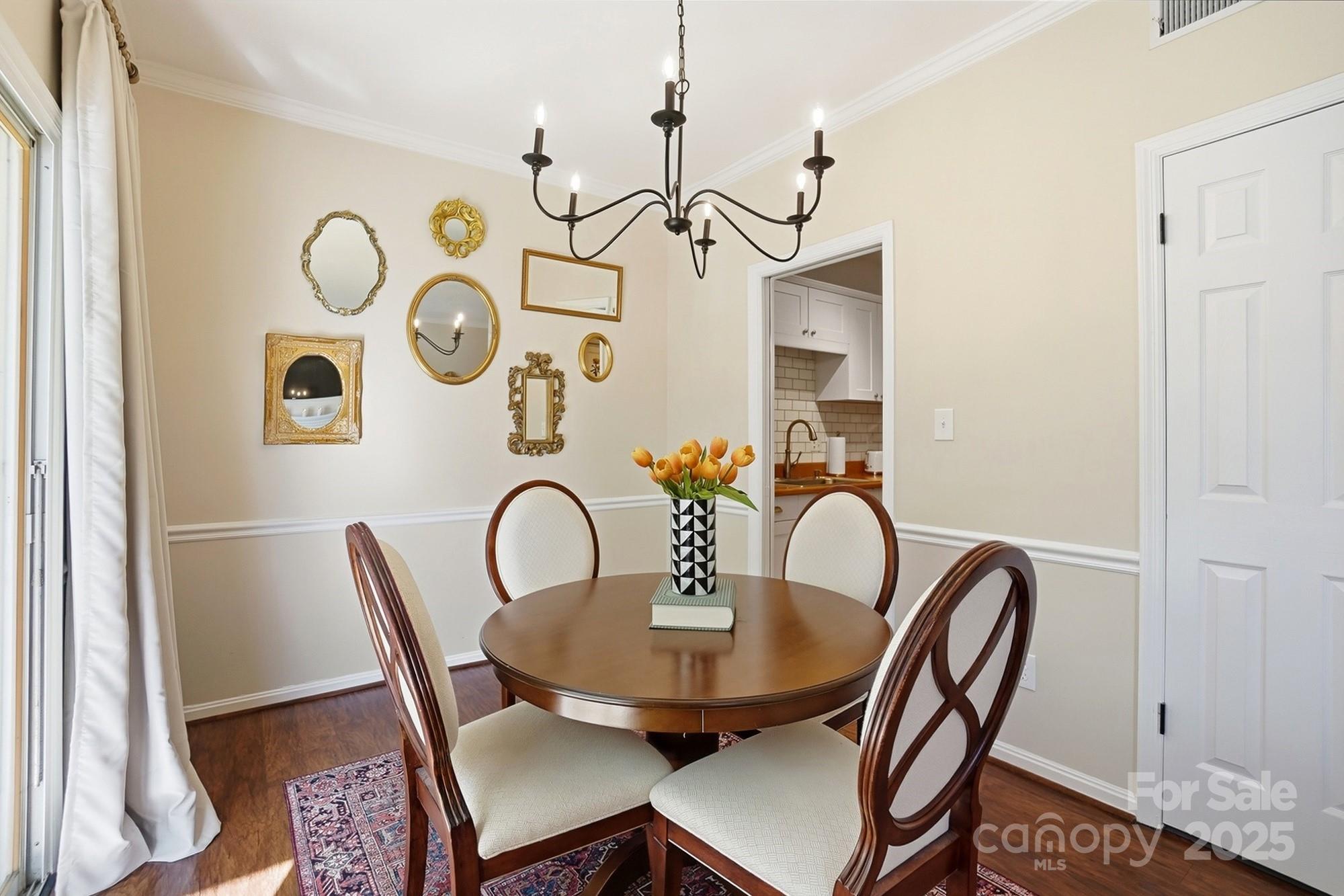 5913 Quail Hollow Road Charlotte, NC 28210 - Photo 15 of 47 a view of a dining room with furniture and wooden floor