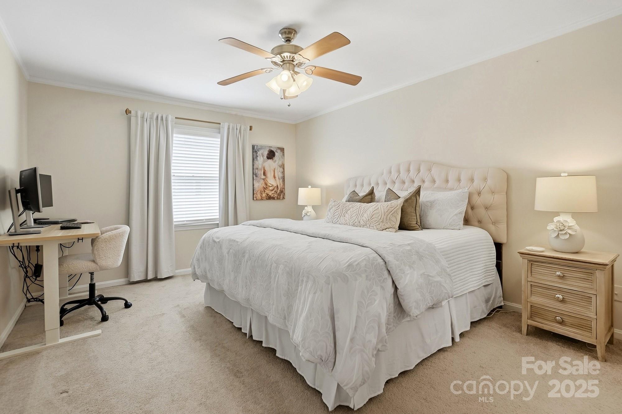 5913 Quail Hollow Road Charlotte, NC 28210 - Photo 30 of 47 a bedroom with a bed and a chair with the potted plant on the dresser