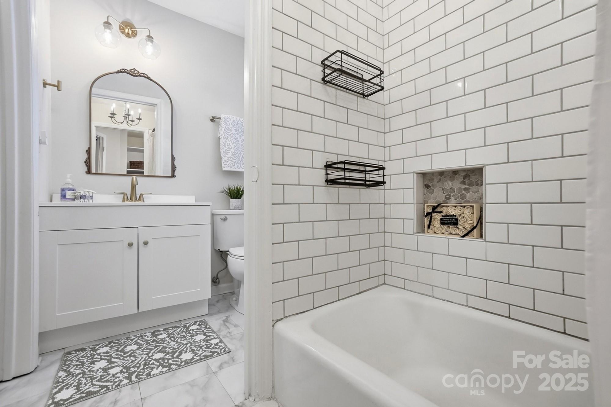 5913 Quail Hollow Road Charlotte, NC 28210 - Photo 39 of 47 a bathroom with a bathtub and shower