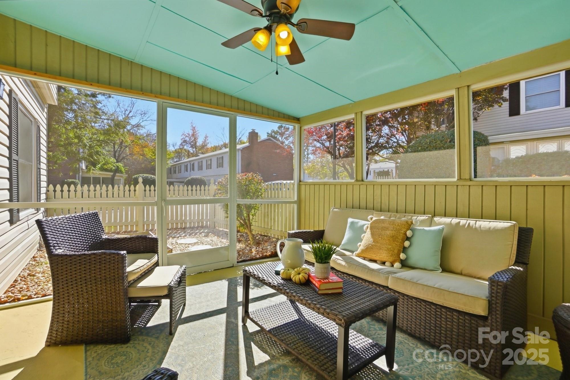 5913 Quail Hollow Road Charlotte, NC 28210 - Photo 43 of 47 a living room with furniture and a floor to ceiling window