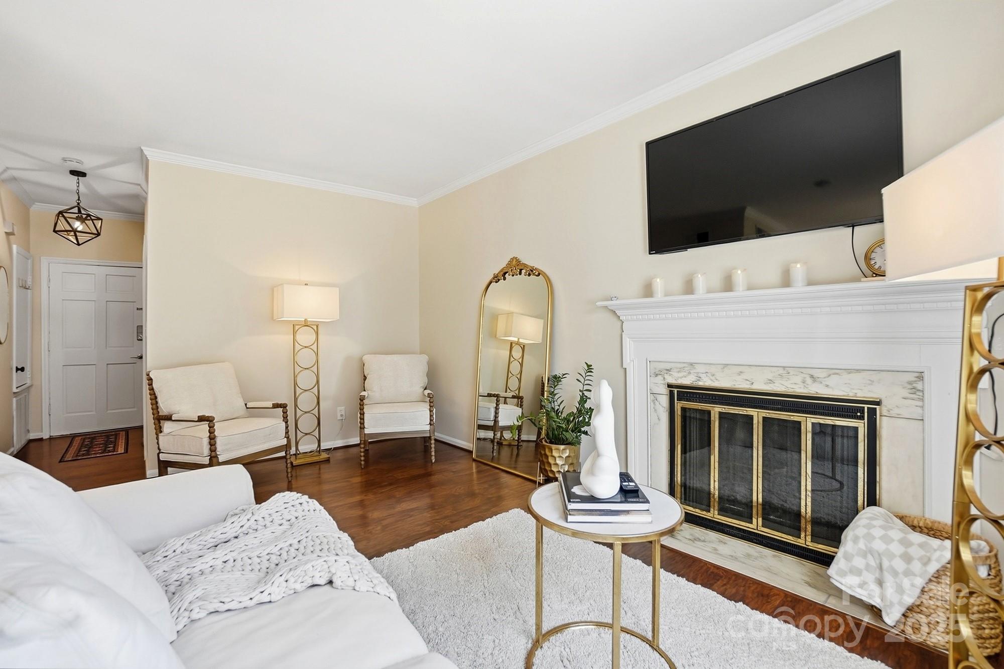 5913 Quail Hollow Road Charlotte, NC 28210 - Photo 10 of 47 a living room with furniture and a fireplace