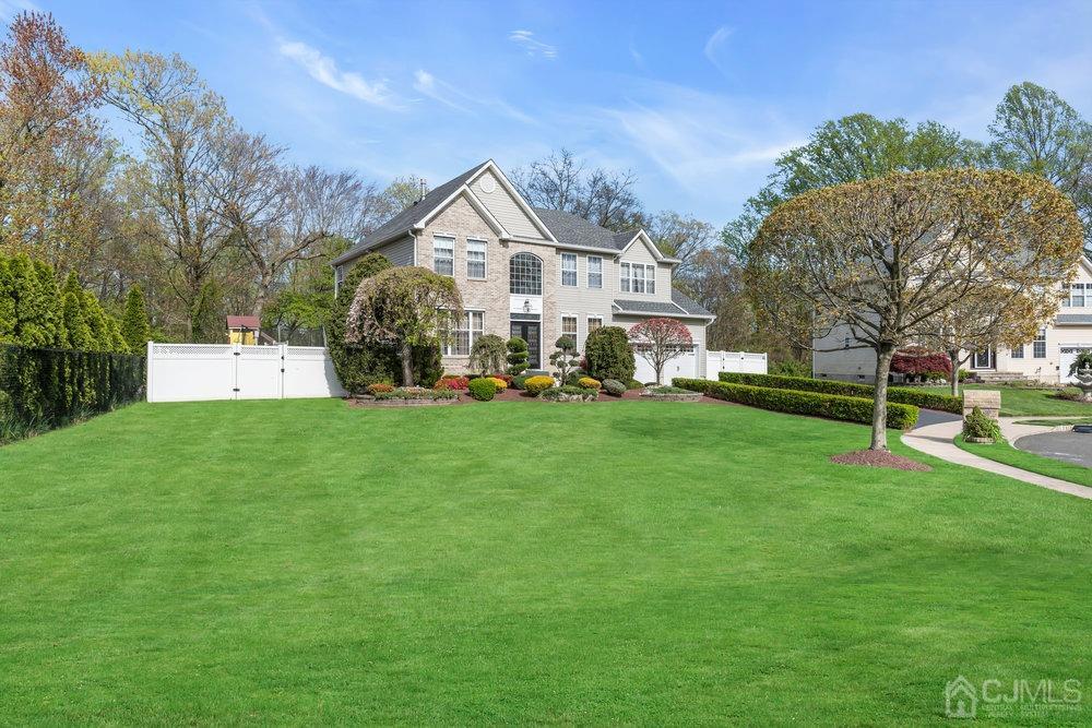 71 Stratton Road Old Bridge, NJ 07747 - Photo 8 of 77 a front view of a house with a yard and trees