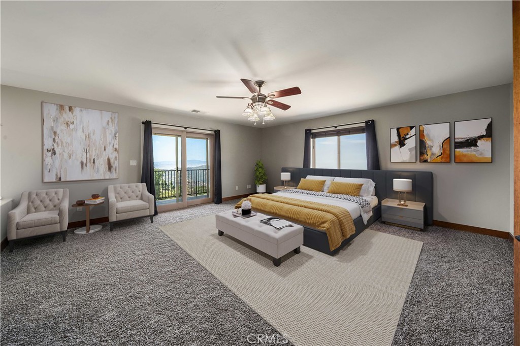 29600 Goldspike Road Tehachapi, CA 93561 - Photo 12 of 48 a bedroom with a large bed couch and a window