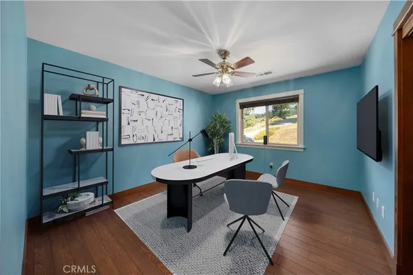 a room with furniture pool table and window