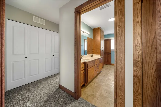a view of a bathroom with sink and mirror