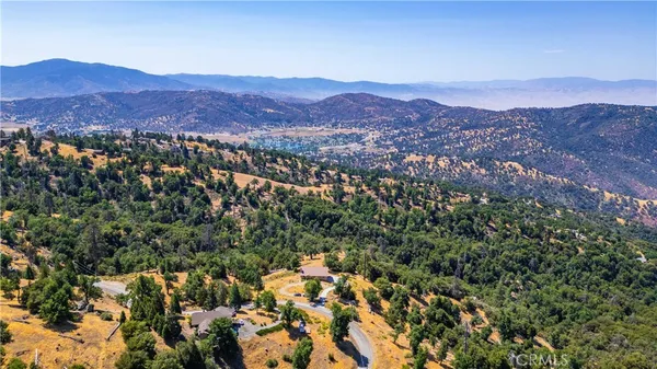 a view of a city with mountains in the background