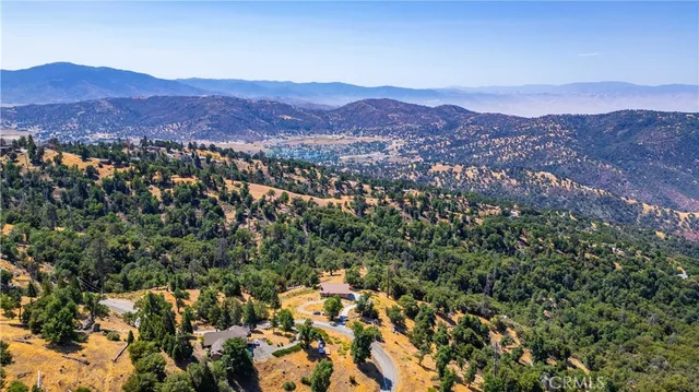 a view of a city with mountains in the background