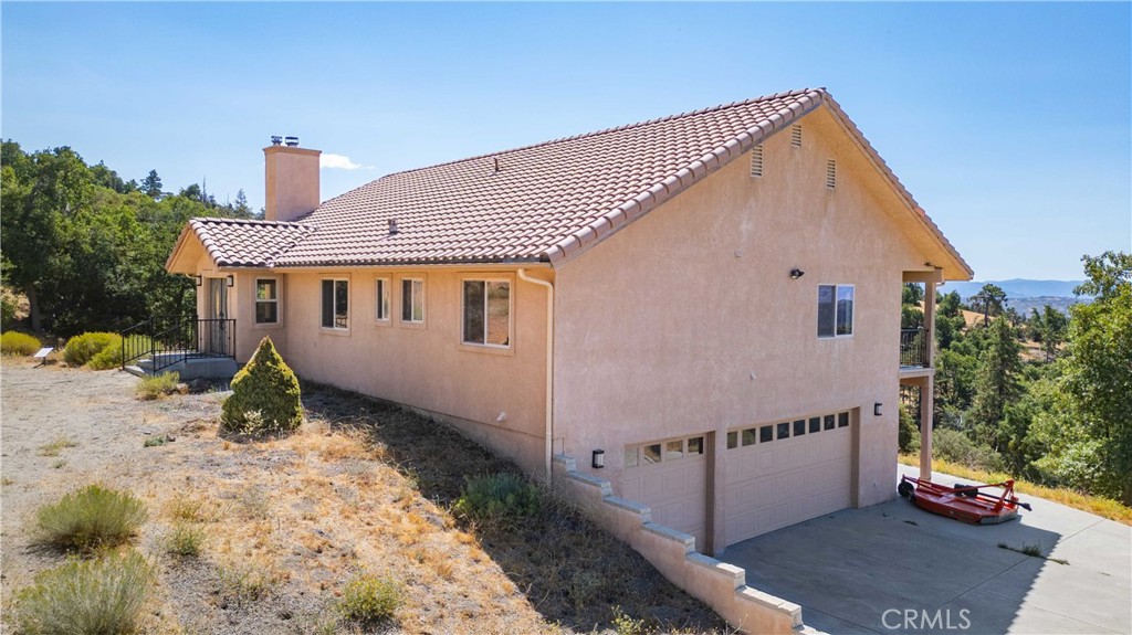 29600 Goldspike Road Tehachapi, CA 93561 - Photo 3 of 48 a view of a house with wooden fence
