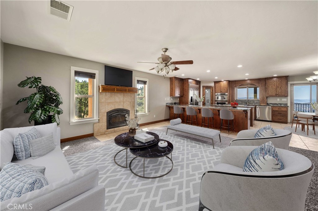 29600 Goldspike Road Tehachapi, CA 93561 - Photo 4 of 48 a living room with furniture and a fireplace