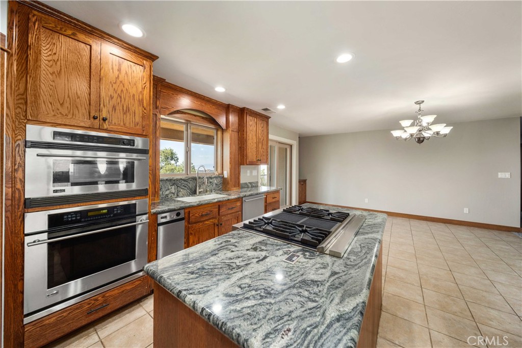 29600 Goldspike Road Tehachapi, CA 93561 - Photo 10 of 48 a kitchen with a stove and a microwave