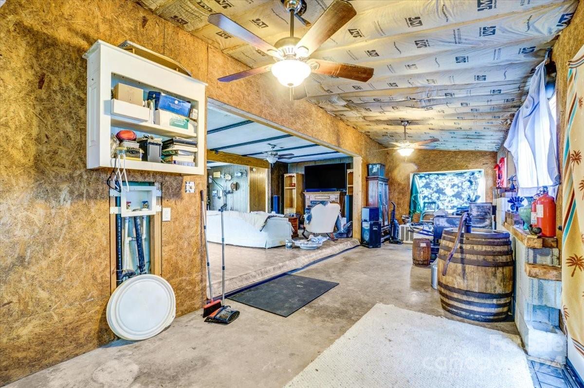 152 Midway Lake Road Mooresville, NC 28115 - Photo 13 of 24 a room with lots of gym equipment