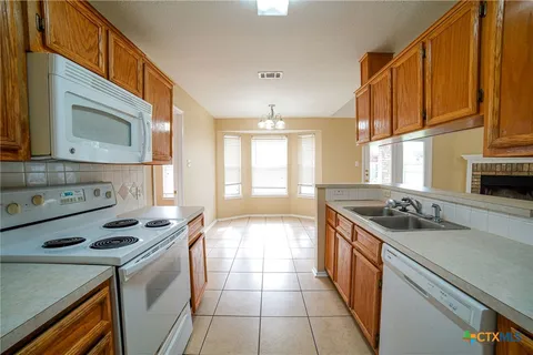 a kitchen with a stove and a sink