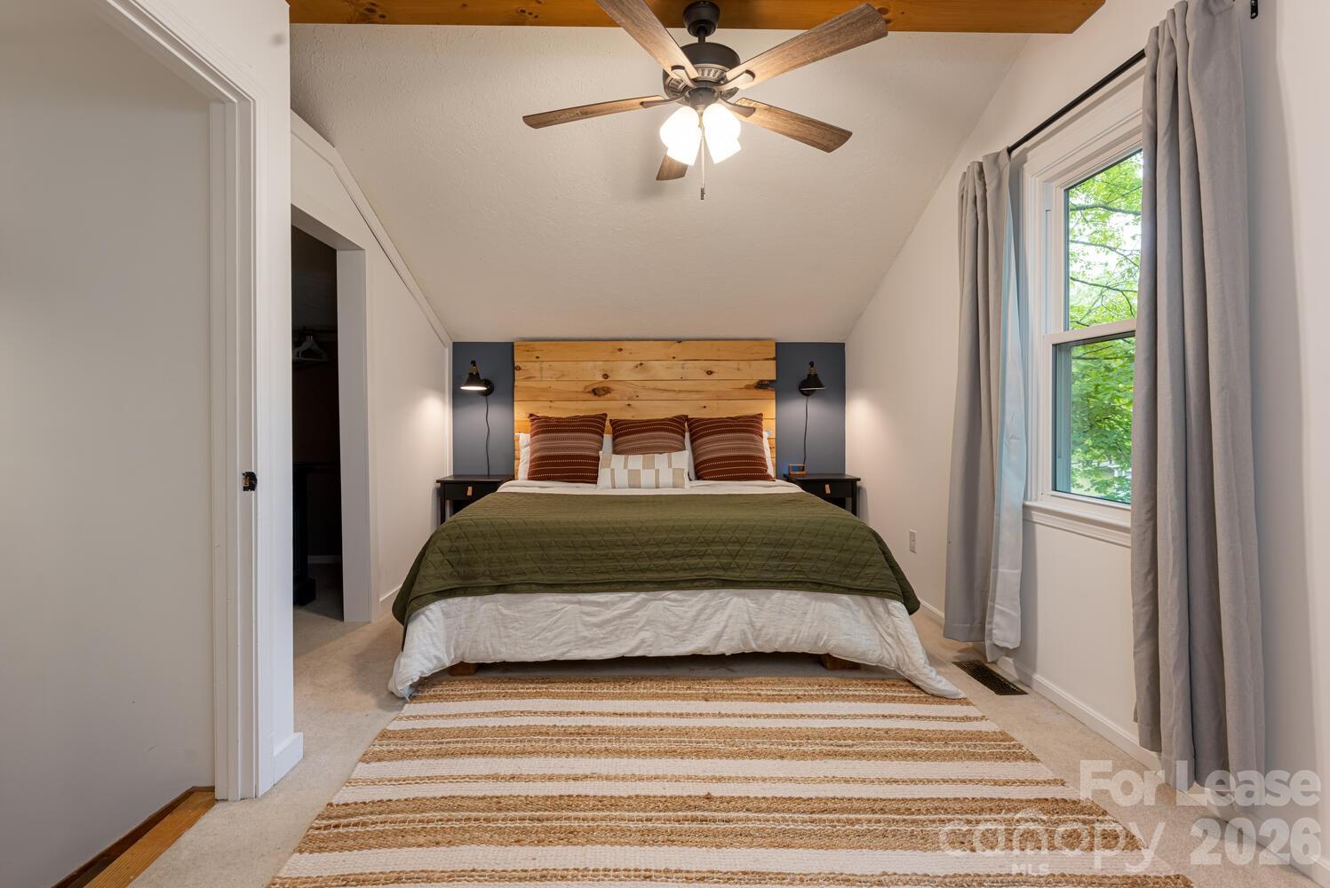 260 Allison Hill Road Brevard, NC 28712 - Photo 27 of 41 a bedroom with a bed and a window