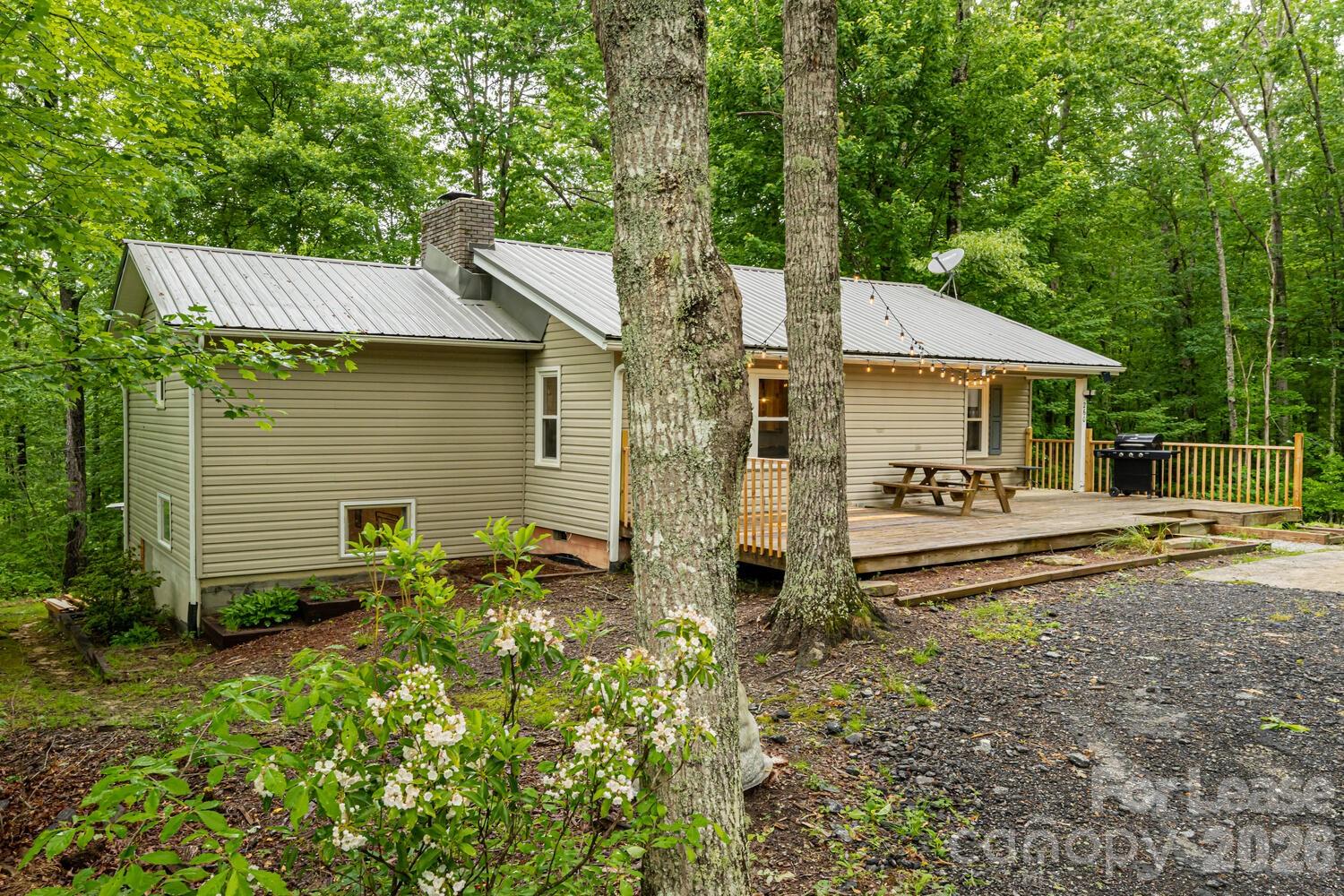 260 Allison Hill Road Brevard, NC 28712 - Photo 7 of 41 a front view of a house with garden